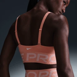 Nike Women's Pro Indy Plunge Women's Medium-Support Padded Sports Bra (844 - Apricot Agate/Washed Coral/White) -TCRunning Shop AURORA HF7324 844 PHSYM002 2000