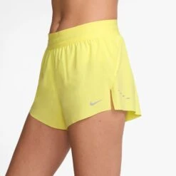 Nike Women's Swift Dri-FIT Mid-Rise 2.5" Brief-Lined Running Shorts (712 - Light Zitron/Reflective Silver) -TCRunning Shop AURORA HQ0638 712 PHSYM001 2000
