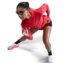 Nike Women's Swift Repel Packable Running Jacket (696 - LT Crimson/Reflective Silver) 13 Nike Women's Swift Repel Packable Running Jacket (696 - LT Crimson/Reflective Silver) -TCRunning Shop AURORA HQ0650 696 PHSYM003 2000